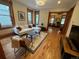 Bright living room featuring hardwood floors, a comfortable sofa, and elegant decor throughout at 2335 Stout St, Denver, CO 80205