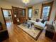Cozy living room with hardwood floors, built-in shelving, and ample natural light, great for relaxing at 2335 Stout St, Denver, CO 80205