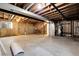 An unfinished basement with exposed ductwork and concrete walls at 5373 S Prescott St, Littleton, CO 80120