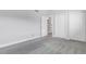 Bedroom featuring neutral walls, plush gray carpet, and white closet doors at 5373 S Prescott St, Littleton, CO 80120