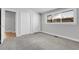 Bedroom featuring neutral walls, plush gray carpet, and white closet doors at 5373 S Prescott St, Littleton, CO 80120