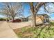 Charming single-story home featuring a brick facade, bright windows, and mature trees in a serene neighborhood at 5373 S Prescott St, Littleton, CO 80120