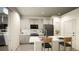 Modern kitchen with island, stainless steel appliances, and ample cabinetry at 22032 E 38Th Pl, Aurora, CO 80019