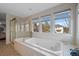 Relaxing bathroom with a soaking tub and shower at 1 Mountain Birch, Littleton, CO 80127