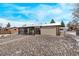 Backyard featuring a versatile shed and screened-in sunroom, ideal for storage and relaxation at 779 Alkire St, Lakewood, CO 80401