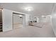 Finished basement features neutral carpet, white paneled walls, and recessed lighting for a bright, spacious living area at 779 Alkire St, Lakewood, CO 80401