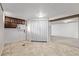 Unfinished basement with built-in cabinets offers ample storage and potential for customization to suit any needs at 779 Alkire St, Lakewood, CO 80401