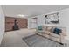 Cozy finished basement with brick fireplace, patterned rug, and comfortable seating area provides a relaxing atmosphere at 779 Alkire St, Lakewood, CO 80401