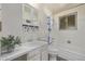 Bright bathroom with a vanity, mirrored cabinet, and shower-tub combination at 779 Alkire St, Lakewood, CO 80401