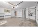 Spacious garage with built-in shelving provides ample storage and organization options for tools and equipment at 779 Alkire St, Lakewood, CO 80401