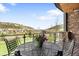 Charming balcony offering stunning views of the neighborhood and mountains, perfect for enjoying a morning coffee at 15116 Lyons Ridge Dr, Morrison, CO 80465