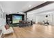Finished basement with a golf simulator, a projector, and plenty of lounge space at 15116 Lyons Ridge Dr, Morrison, CO 80465