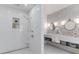Elegant bathroom featuring a walk-in shower and double sink vanity with modern fixtures at 15116 Lyons Ridge Dr, Morrison, CO 80465