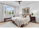 Bedroom with a large window, a queen-sized bed, and a bench at 15116 Lyons Ridge Dr, Morrison, CO 80465
