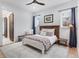 Cozy bedroom featuring a bed, a small bench, and two windows at 15116 Lyons Ridge Dr, Morrison, CO 80465