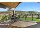 Inviting outdoor deck with comfortable seating, perfect for relaxing and enjoying scenic views of the beautiful landscape at 15116 Lyons Ridge Dr, Morrison, CO 80465