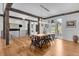 Spacious dining area featuring wood floors, modern lighting, and access to the outdoors at 15116 Lyons Ridge Dr, Morrison, CO 80465