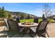 Inviting stone fire pit with comfortable seating, ideal for cozy evenings and gatherings in the beautiful outdoor space at 15116 Lyons Ridge Dr, Morrison, CO 80465