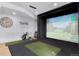 A golf simulator in the finished basement provides entertainment and practice space at 15116 Lyons Ridge Dr, Morrison, CO 80465