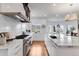 Gourmet kitchen with stainless steel appliances, gas range, and expansive island for cooking and entertaining at 15116 Lyons Ridge Dr, Morrison, CO 80465