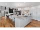 Elegant kitchen with a large island, stainless steel sink, and open layout at 15116 Lyons Ridge Dr, Morrison, CO 80465