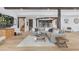 Spacious living room with hardwood floors, cozy seating, and a view of the adjacent kitchen at 15116 Lyons Ridge Dr, Morrison, CO 80465