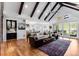 Open-concept living space with vaulted ceilings, wood floors, and elegant furniture at 15116 Lyons Ridge Dr, Morrison, CO 80465
