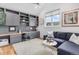 Comfortable office space with built-in shelves, a cozy couch, and a window with scenic views at 15116 Lyons Ridge Dr, Morrison, CO 80465