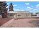 Charming single-story home with neutral siding, white trim, and rock landscaping in the front yard at 3298 S Eudora St, Denver, CO 80222