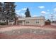 Charming single-story home features a well-maintained yard and a welcoming front entrance at 3298 S Eudora St, Denver, CO 80222