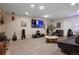 Spacious living room featuring plush seating, a large television, and modern decor at 3298 S Eudora St, Denver, CO 80222