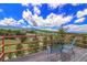 Relaxing balcony setting with chairs overlooking scenic mountains and a nearby athletic field at 10550 Highway 73, Conifer, CO 80433