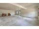 Spacious basement with neutral walls, concrete floor, and outdoor access at 10550 Highway 73, Conifer, CO 80433