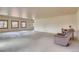 Large basement features concrete floors, neutral walls, and windows for natural light at 10550 Highway 73, Conifer, CO 80433