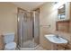 Bathroom features a glass-enclosed shower, vanity, and tiled accents at 10550 Highway 73, Conifer, CO 80433