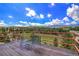 Enjoy the view from this wooden deck with red railing and comfortable seating at 10550 Highway 73, Conifer, CO 80433
