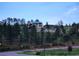 View of a unique home surrounded by lush greenery, offering a sense of privacy and seclusion on the hillside at 10550 Highway 73, Conifer, CO 80433