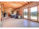 Spacious garage featuring an open layout with natural light from large sliding glass doors at 10550 Highway 73, Conifer, CO 80433