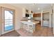 Eat-in kitchen with breakfast bar, tile floors, and stainless steel appliances at 10550 Highway 73, Conifer, CO 80433