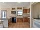 Functional kitchen featuring tile floors, a breakfast bar, and ample counter space at 10550 Highway 73, Conifer, CO 80433