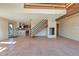 Bright living room featuring tile floors, a staircase, and an open layout at 10550 Highway 73, Conifer, CO 80433