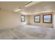 Large room featuring natural light from three windows and ample square footage at 10550 Highway 73, Conifer, CO 80433
