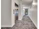 Hallway in a modern condo building featuring an elevator, neutral walls, and well-lit space at 1304 Snowberry # 102, Louisville, CO 80027