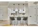 Modern kitchen boasts pendant lighting over a breakfast bar with seating at 1304 Snowberry # 102, Louisville, CO 80027