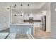 Well-lit modern kitchen with stainless steel appliances and kitchen island at 1304 Snowberry # 102, Louisville, CO 80027