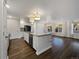 Modern kitchen with white cabinetry, granite countertops and island at 2117 Collyer St, Longmont, CO 80501