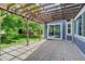 Inviting back deck featuring a pergola strung with lights, perfect for outdoor relaxation and entertaining at 7831 W 109Th Ave, Westminster, CO 80021