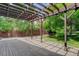 Outdoor patio with a pergola and lush landscaping in the backyard at 7831 W 109Th Ave, Westminster, CO 80021