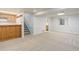 Finished basement with carpet, stairs, bar, and cabinets at 7831 W 109Th Ave, Westminster, CO 80021