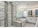 Modern bathroom with a glass-enclosed shower, a soaking tub, and dual sinks with great finishes at 7831 W 109Th Ave, Westminster, CO 80021